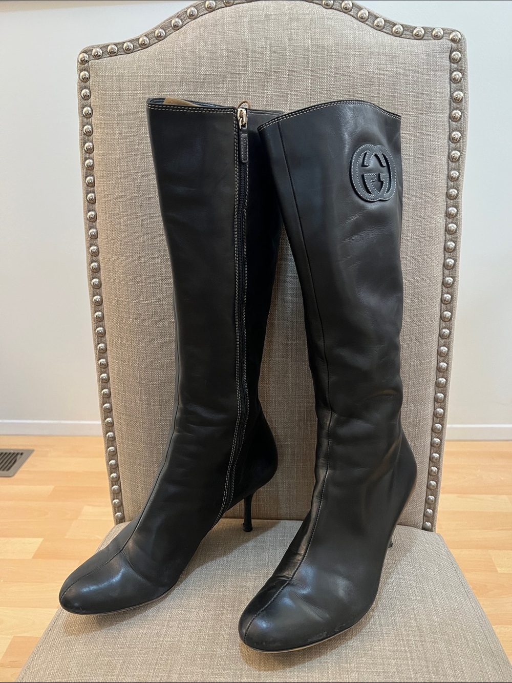 Gucci Black Leather Knee-High Stiletto Boots with Embossed Logo